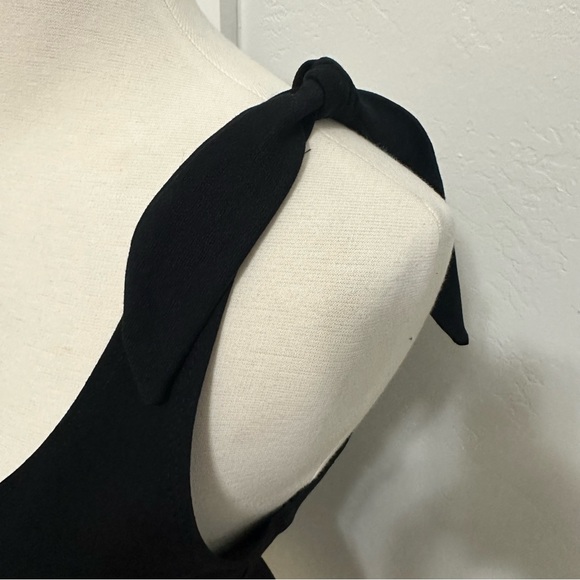 Fun short black knit flirty bow strap day dress. - Picture 2 of 6